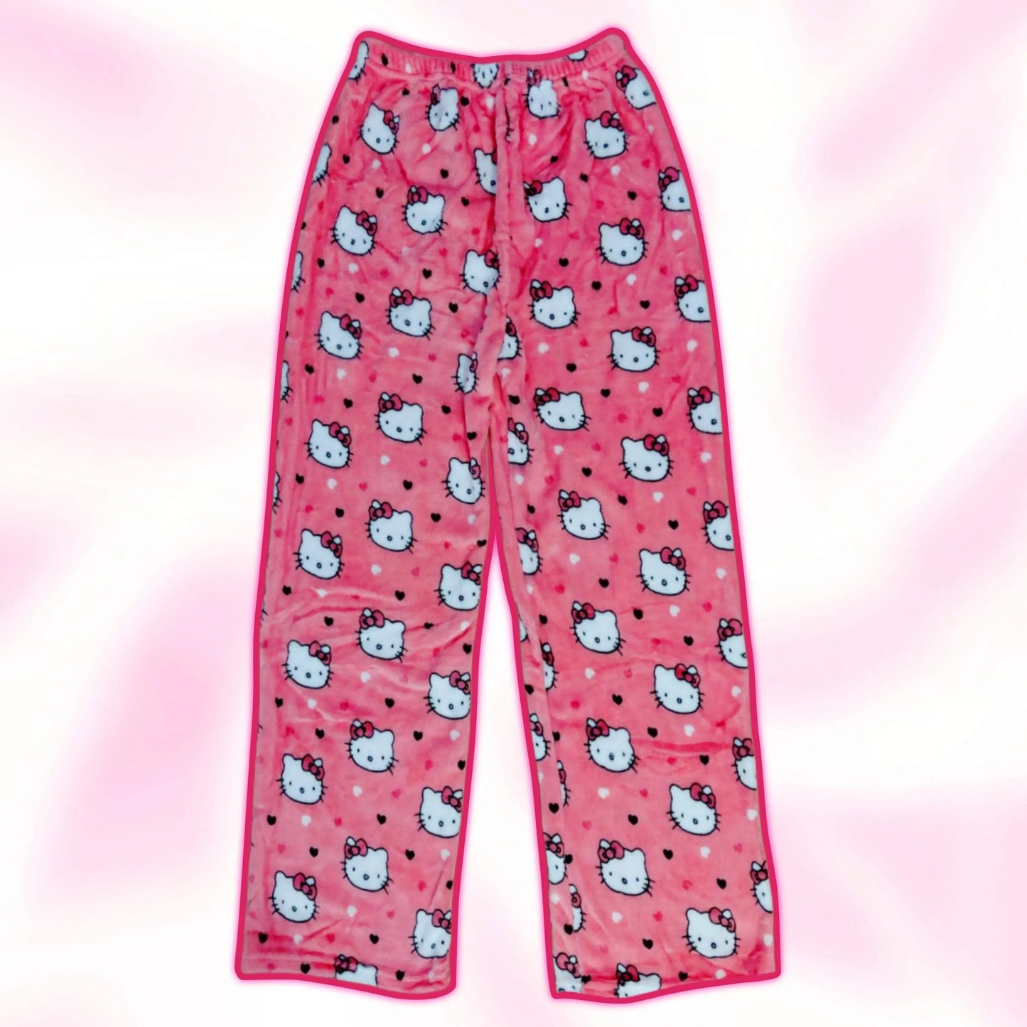 Pink pajama pants with Hello Kitty faces print and pink trim