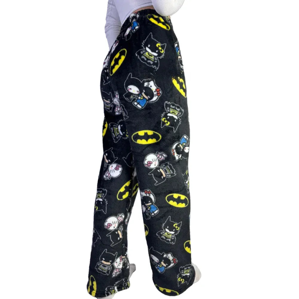 Black pajama pants with repeating character print and relaxed straight fit.