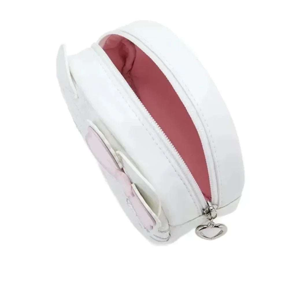 White cosmetics bag with metal zipper and pink interior lining, side view