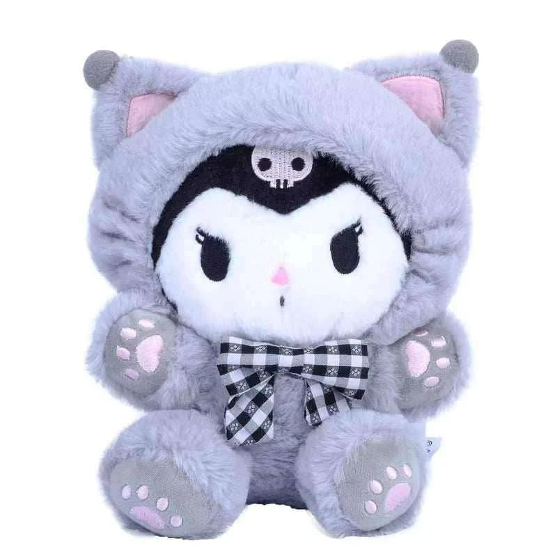 Gray plush cat character in a hood, black skull face patch and striped bow