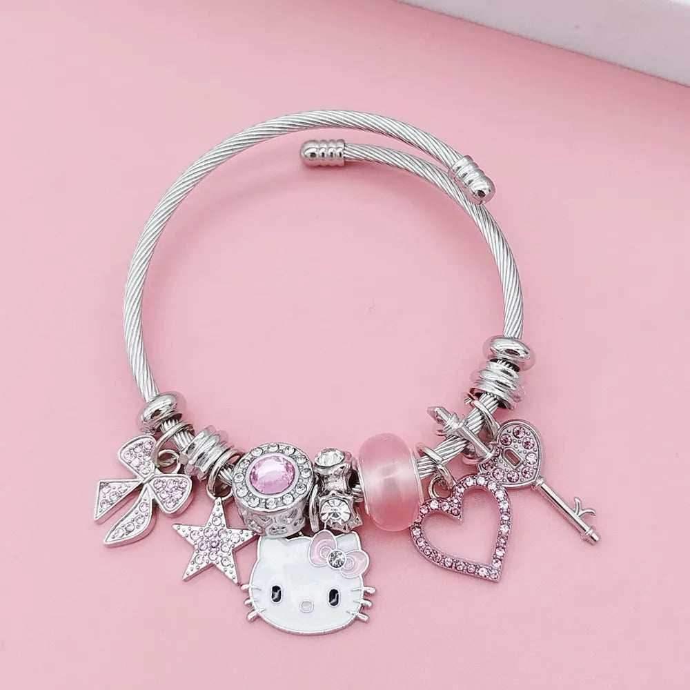 Silver bangle bracelet with bow, stars, pink heart bead, Hello Kitty cat and heart charm