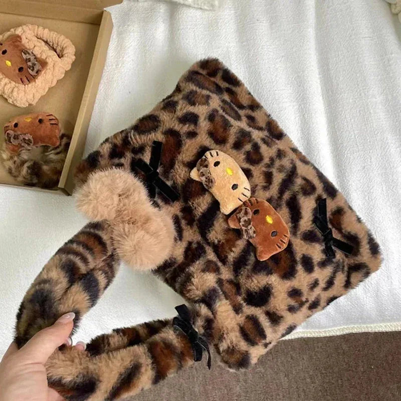 Leopard print plush shopping bag with side view, black bow straps, and Hello Kitty charm