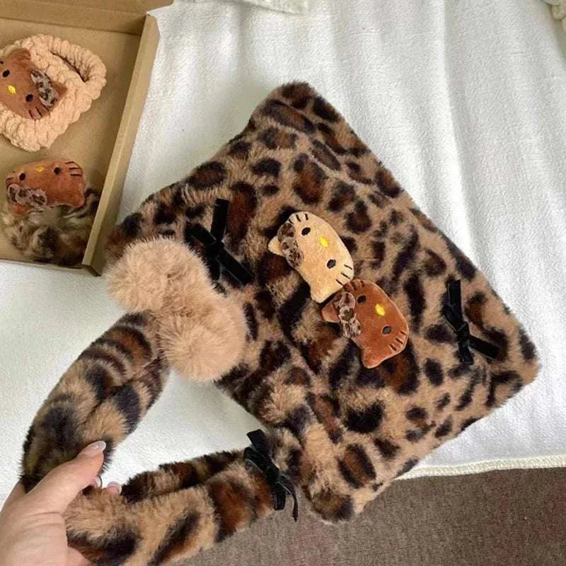 Leopard print plush tote bag with bow handles and Hello Kitty cat charm patches