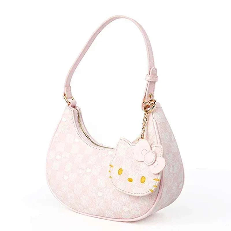 Hello Kitty shoulder bag in pale pink with face charm and curved hobo handle