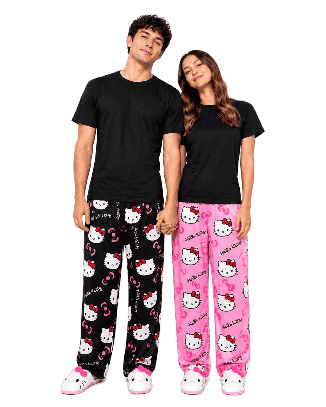 Couple wearing matching Hello Kitty pajama pants in black and pink