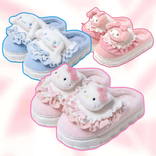 Fuzzy slippers featuring light blue and light pink plush animal faces with ruffled bows
