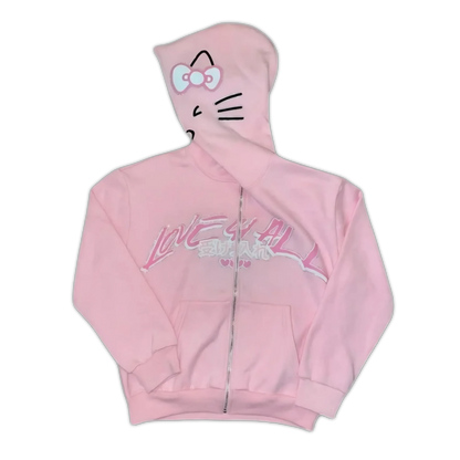 Light pink Hello Kitty zip-up hoodie with purple bow cat face on hood and chest graphic.