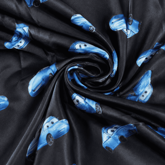 Thin pajama pants fabric with dark background and blue Lightning McQueen characters