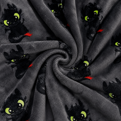 Dragon face pajama fabric in dark gray with green eyes and red details