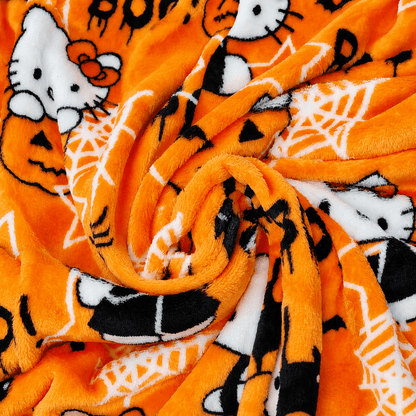 Orange pajama fabric close-up with Hello Kitty, spiders, web stars, and Boo text