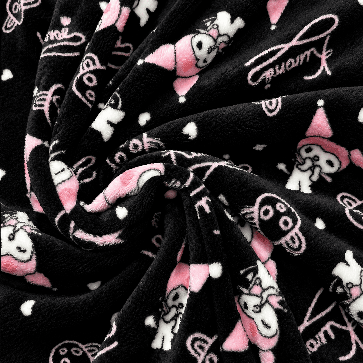 Black pajama pants fabric with pink/white character motifs and doodle accents