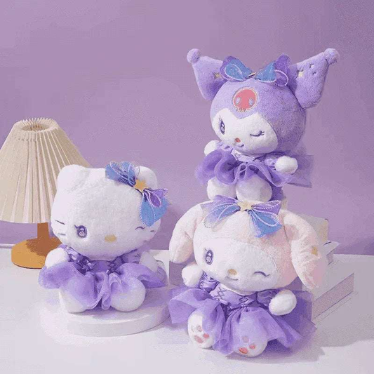 Three pastel plush cat and bunny dolls with bows on a shelf