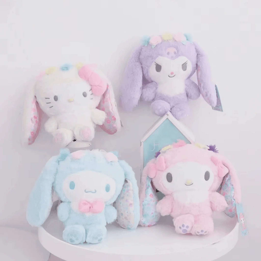 Floral bunny plushies display set: light blue, white, purple, and pink