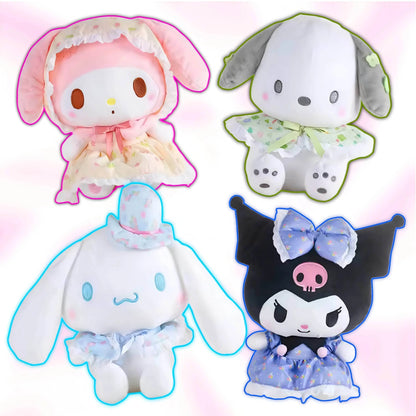 Set of four pastel plush toys wearing hooded outfits and dresses