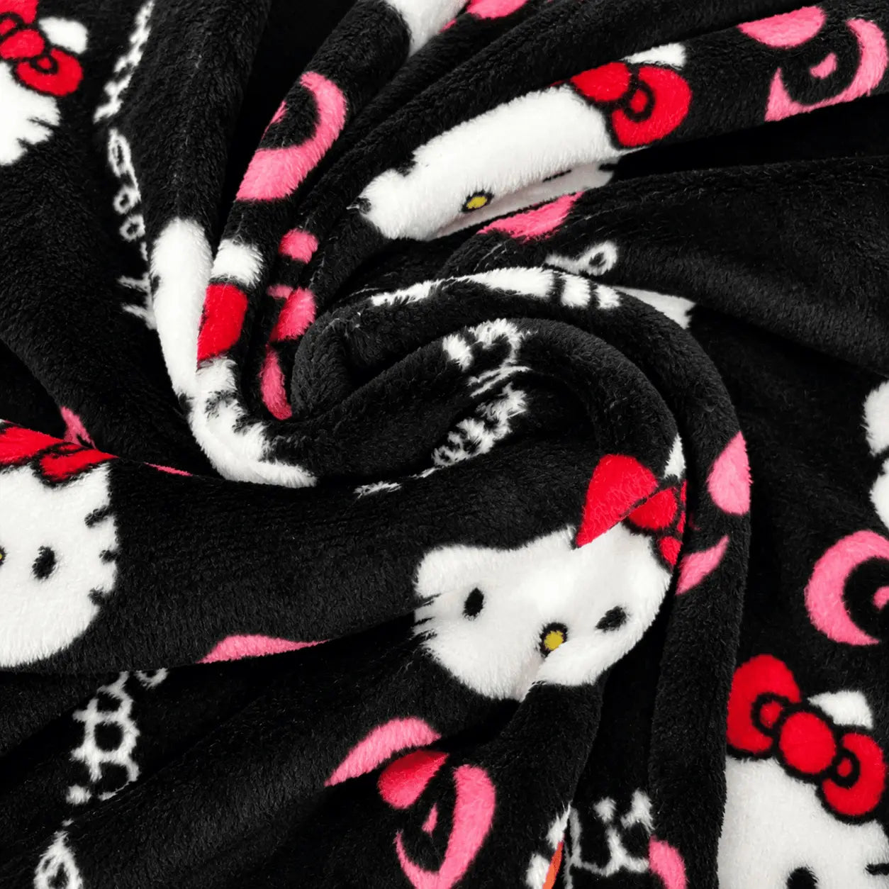 Black plush pajama fabric with Hello Kitty faces and pink/red accents