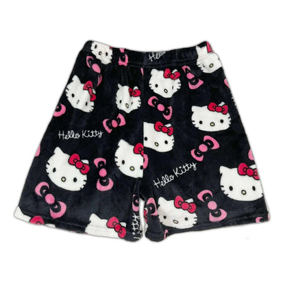 Black pajama shorts with white Hello Kitty faces and pink bow accents
