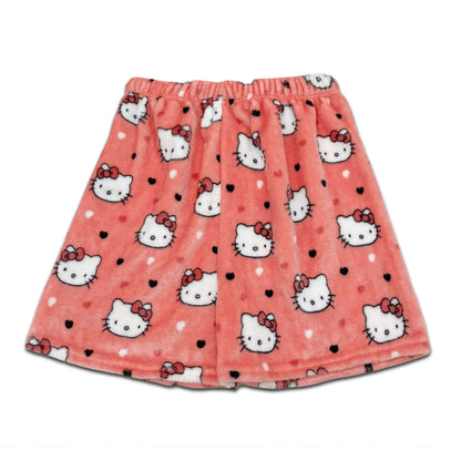 Coral pink pajama shorts with Hello Kitty faces and small black dot accents