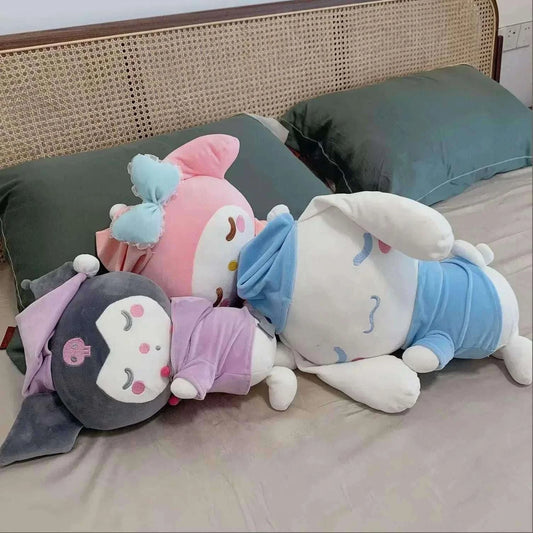 Three character plushies in pink, blue, and gray with cute stitched faces