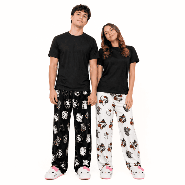 Hello Kitty Halloween pajama pants on models: black and white allover character print