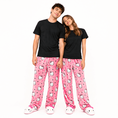 Pink pajama pants with Hello Kitty faces and hearts print