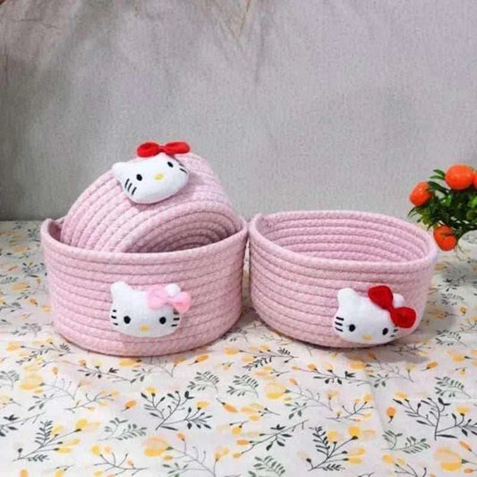 Pink fabric baskets with Hello Kitty faces and red bow accents