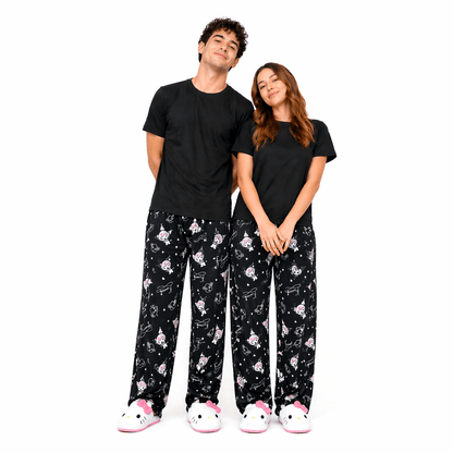 Black pajama pants with pink and white character print and starry doodles