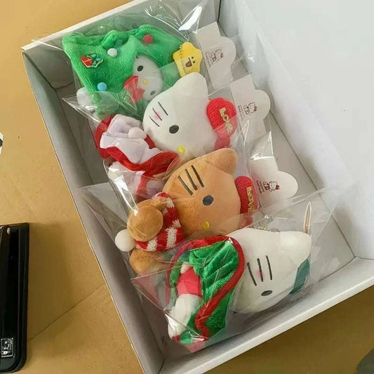Assorted Hello Kitty Christmas plush keychains in a boxed set, in clear plastic.