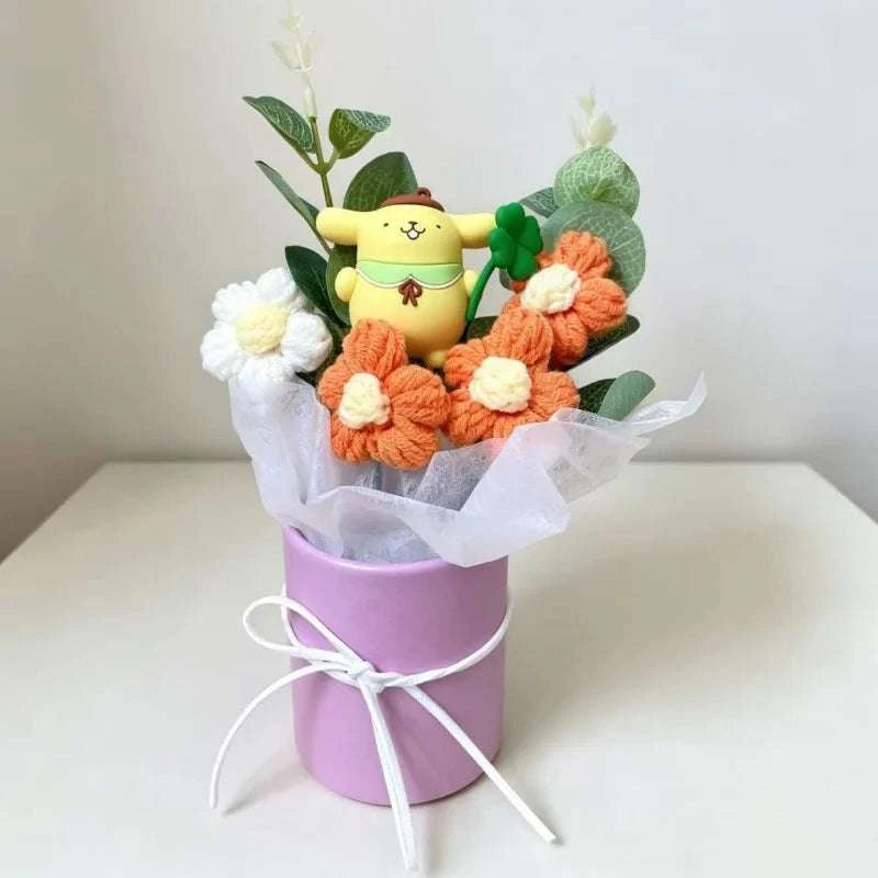 Plush flower arrangement with yellow bear plush and orange crocheted flowers in purple bucket