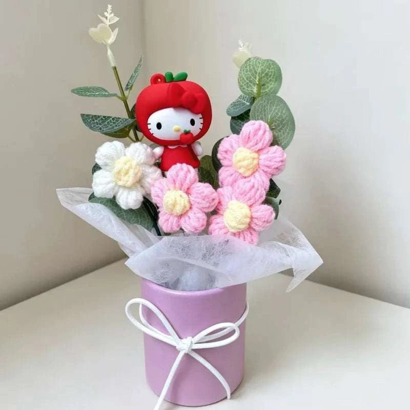 Plush flower arrangement with red Hello Kitty plush and pink crocheted flowers in purple bucket
