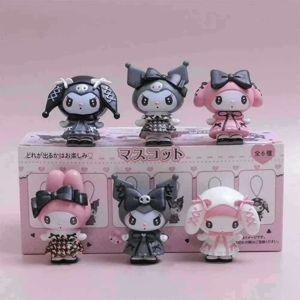 Gothic cuties blind box figurines: three small characters in black and pink outfits