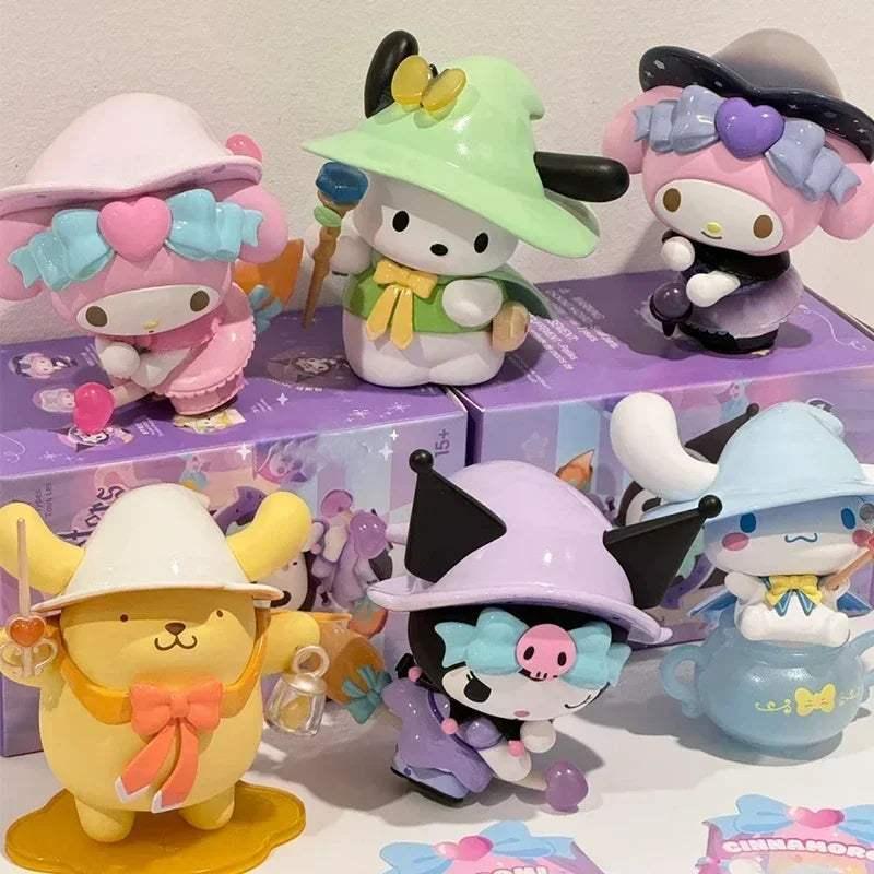 Assorted pastel character figurines on a box lid, including witch hats and horns.