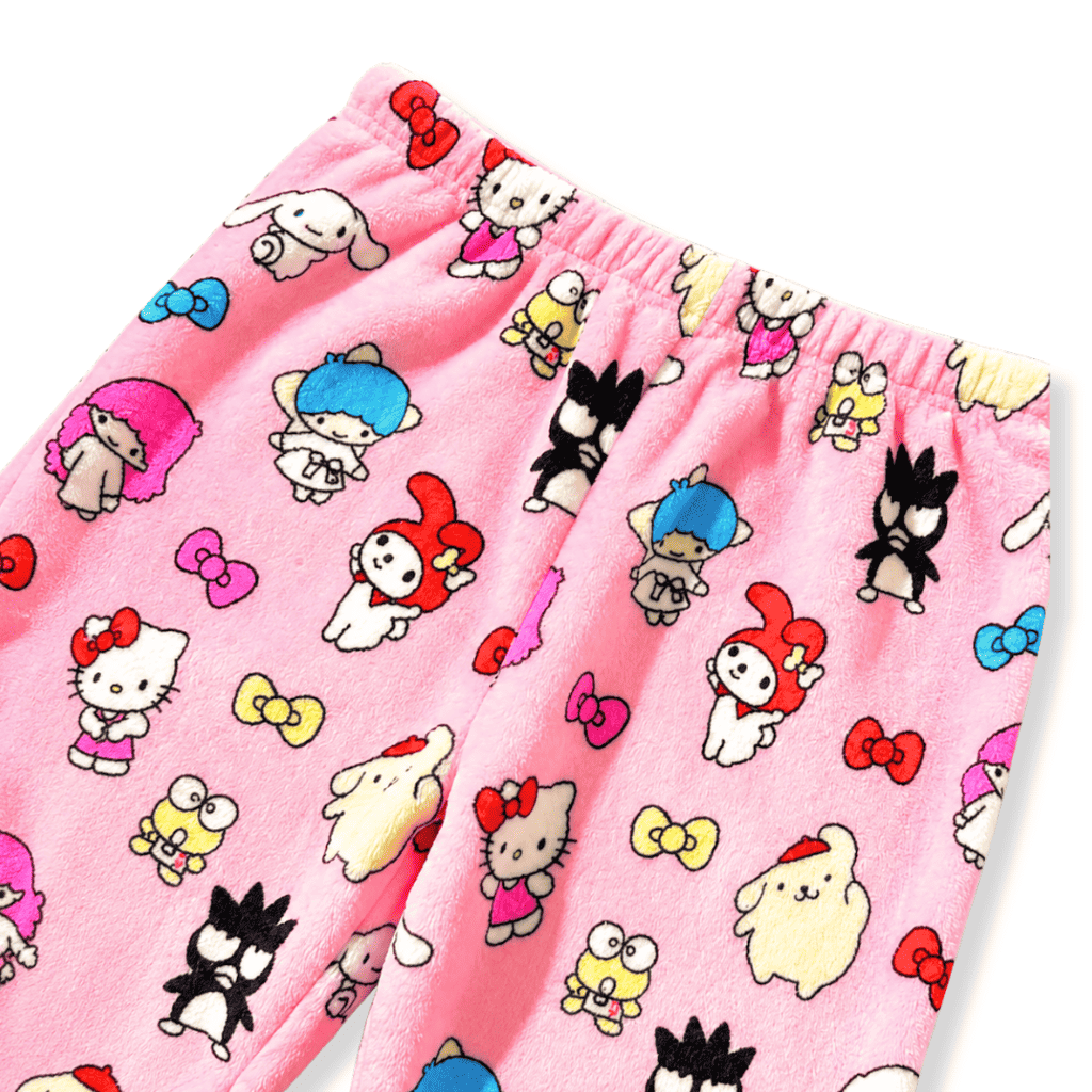 Pink fabric close-up with cartoon characters on pajama pants