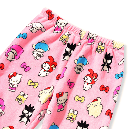 Pink fabric close-up with cartoon characters on pajama pants