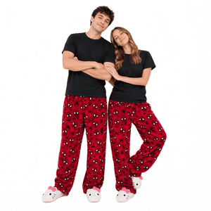 Red Spiderman pajama pants worn by people, loose legs with cuffed ankles